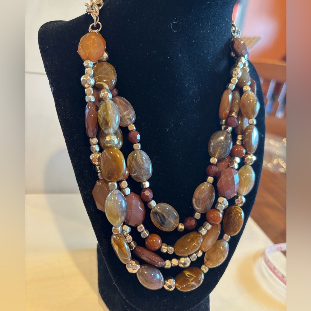 Necklace on chain and four strands of glass and stone beads. 24 to 26” inches